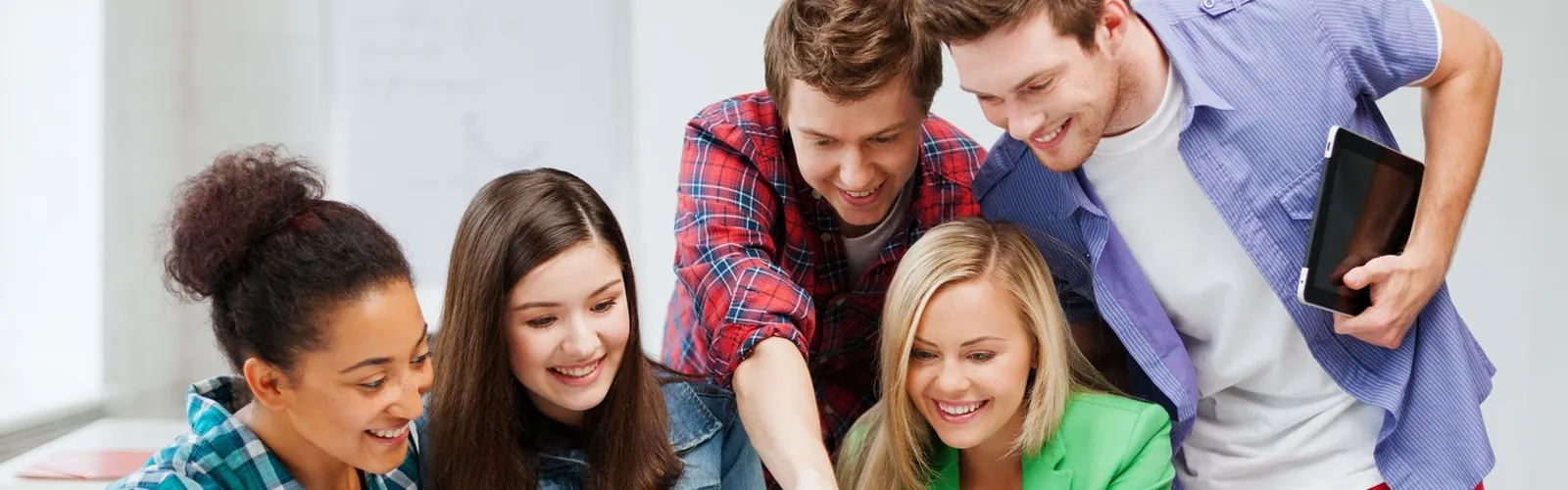 Students looking at computer together