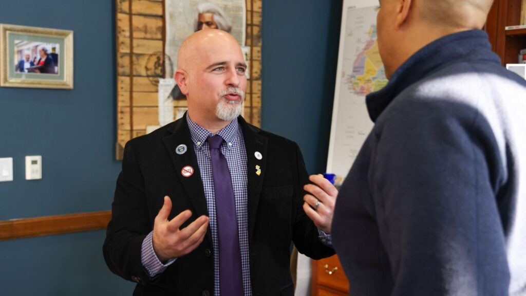 Joseph Nappi speaking with another man