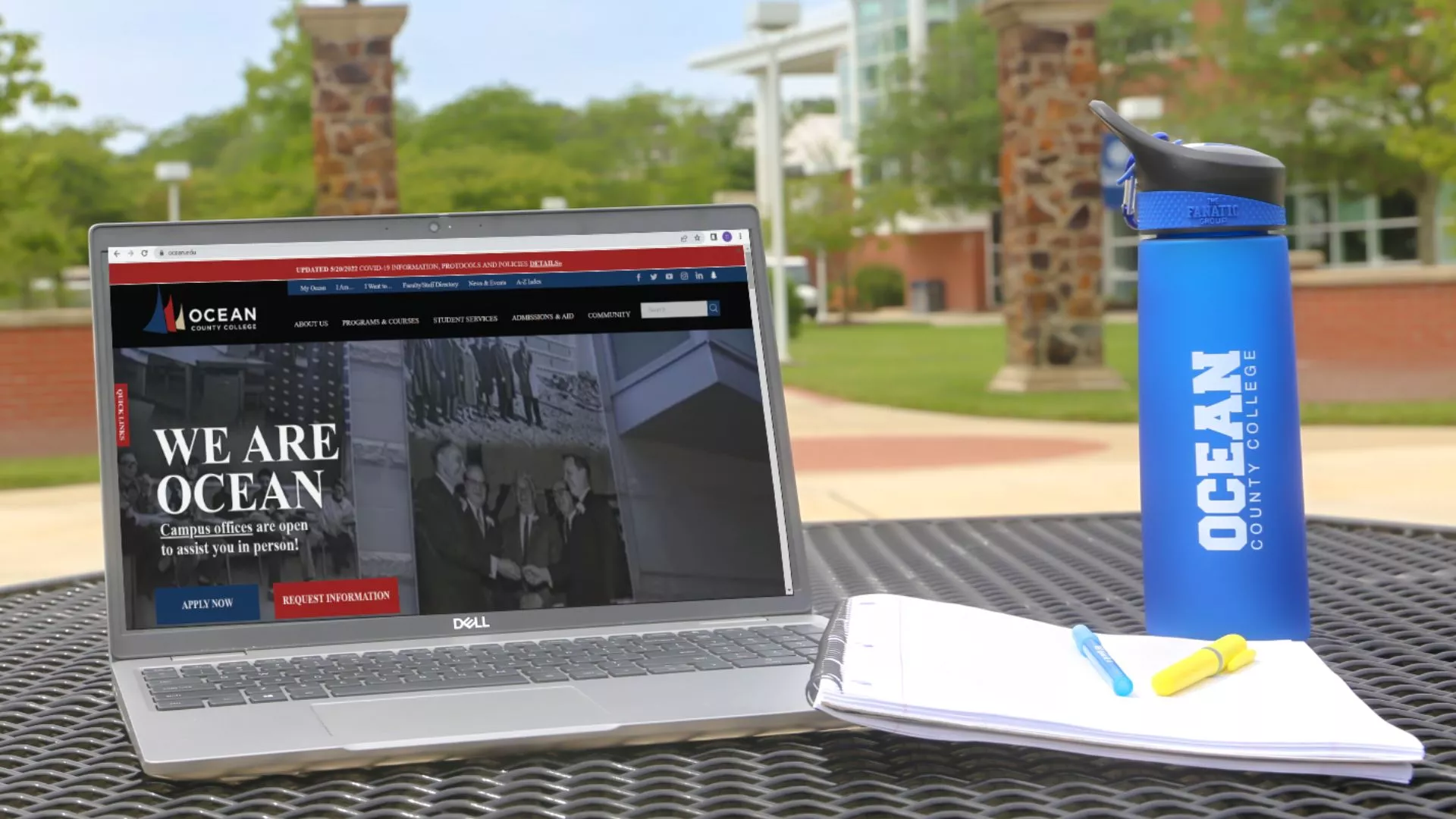 Laptop and water bottle placed outside looking at Ocean County College